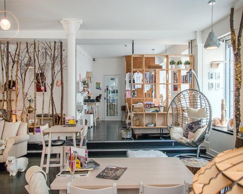 Cozy small discussion space in a modern co-working building with soft pastel chairs
